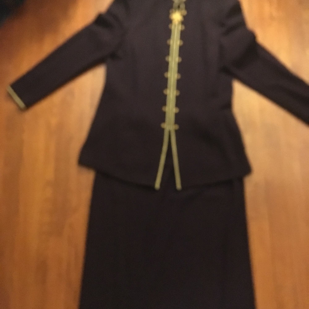 A burgundy blazer and long skirt